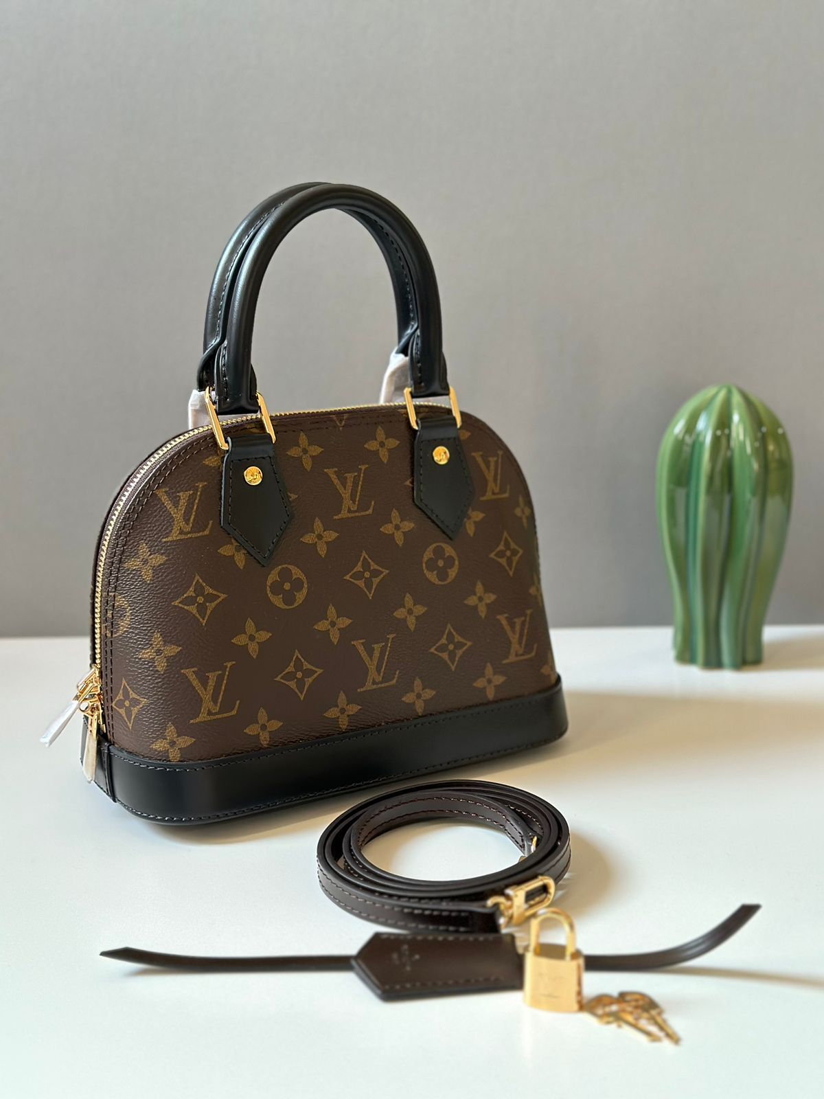 Louis Vuitton Alma BB Handbag (Black Handles)