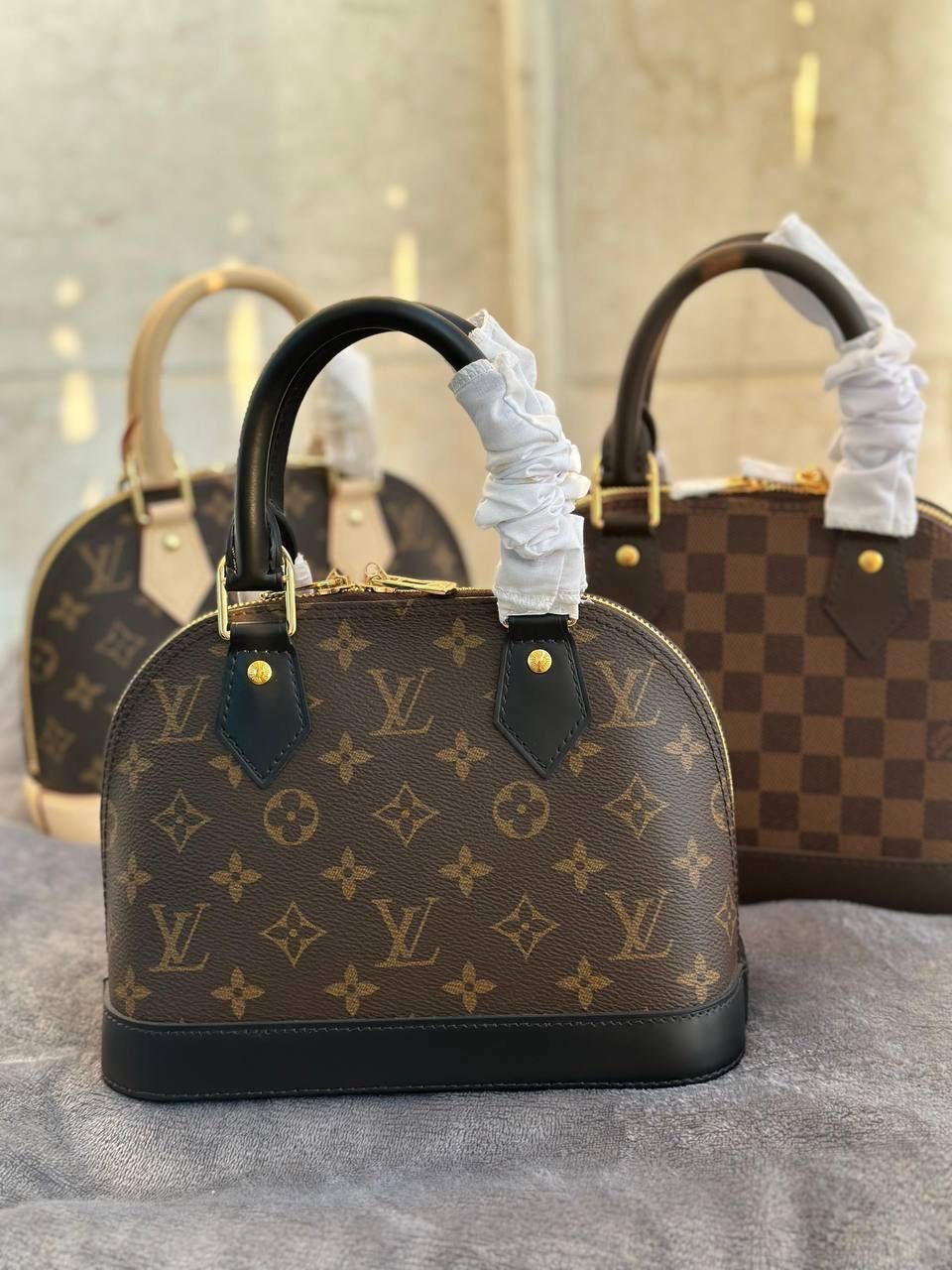Louis Vuitton Alma BB Handbag (Black Handles)